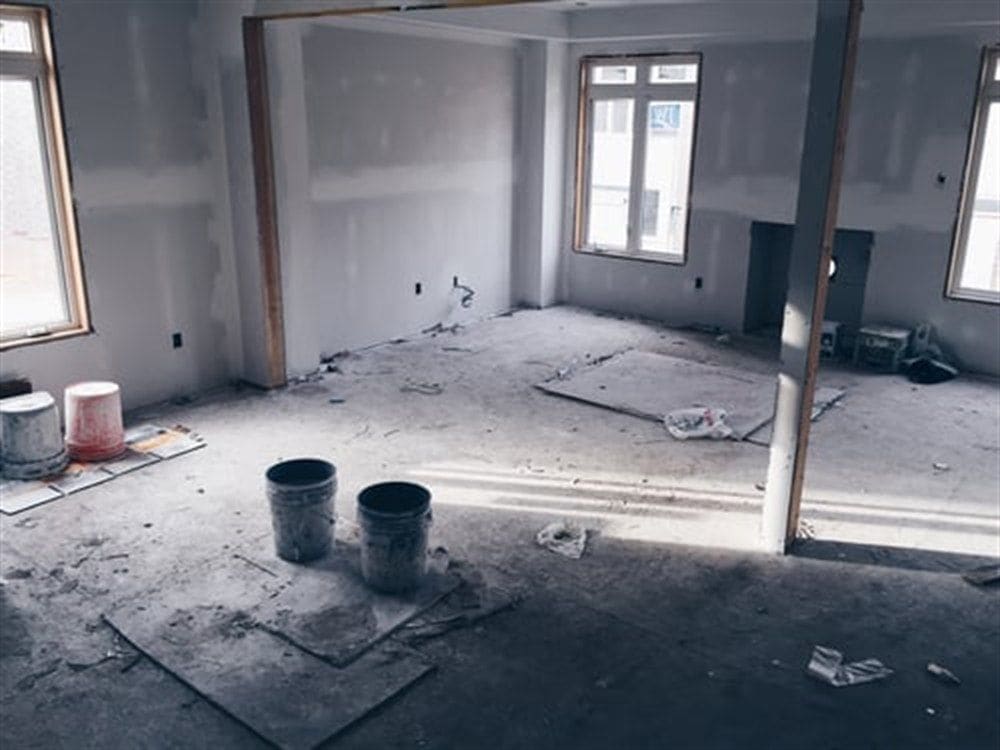 Fine drywall dust being removed from a newly renovated interior during post-construction cleanup